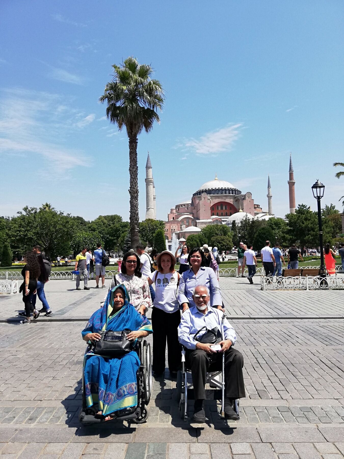 Dilek Orubegarcia with visitors outside Hagia Sophia in Istanbul