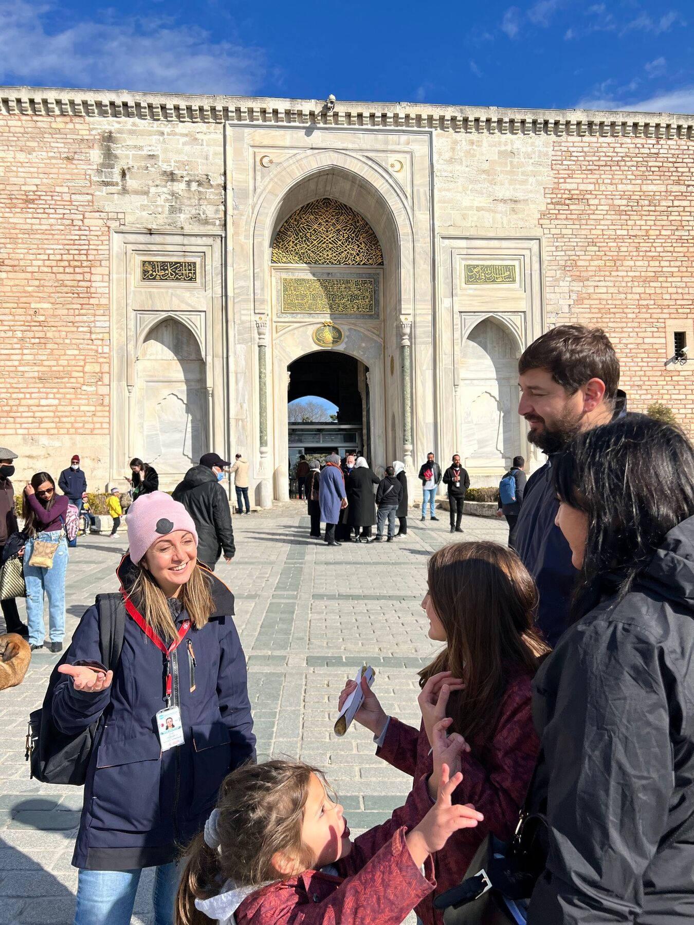 Dilek Orubegarcia guiding visitors outside Topkapi Palace in Istanbul