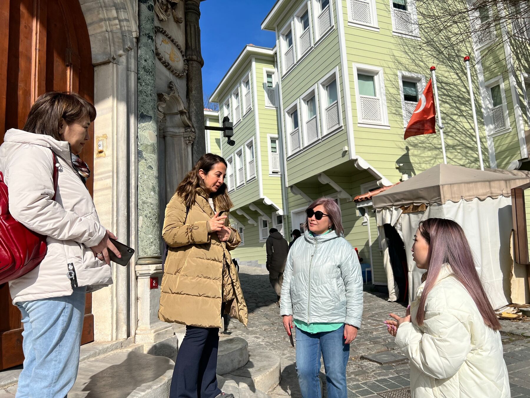 Dilek Orubegarcia speaking with guests during a guided tour in Istanbul