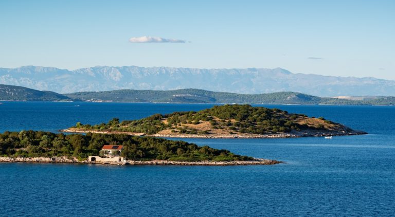 Small tree-covered islands and a stone house in Croatia’s Adriatic Sea