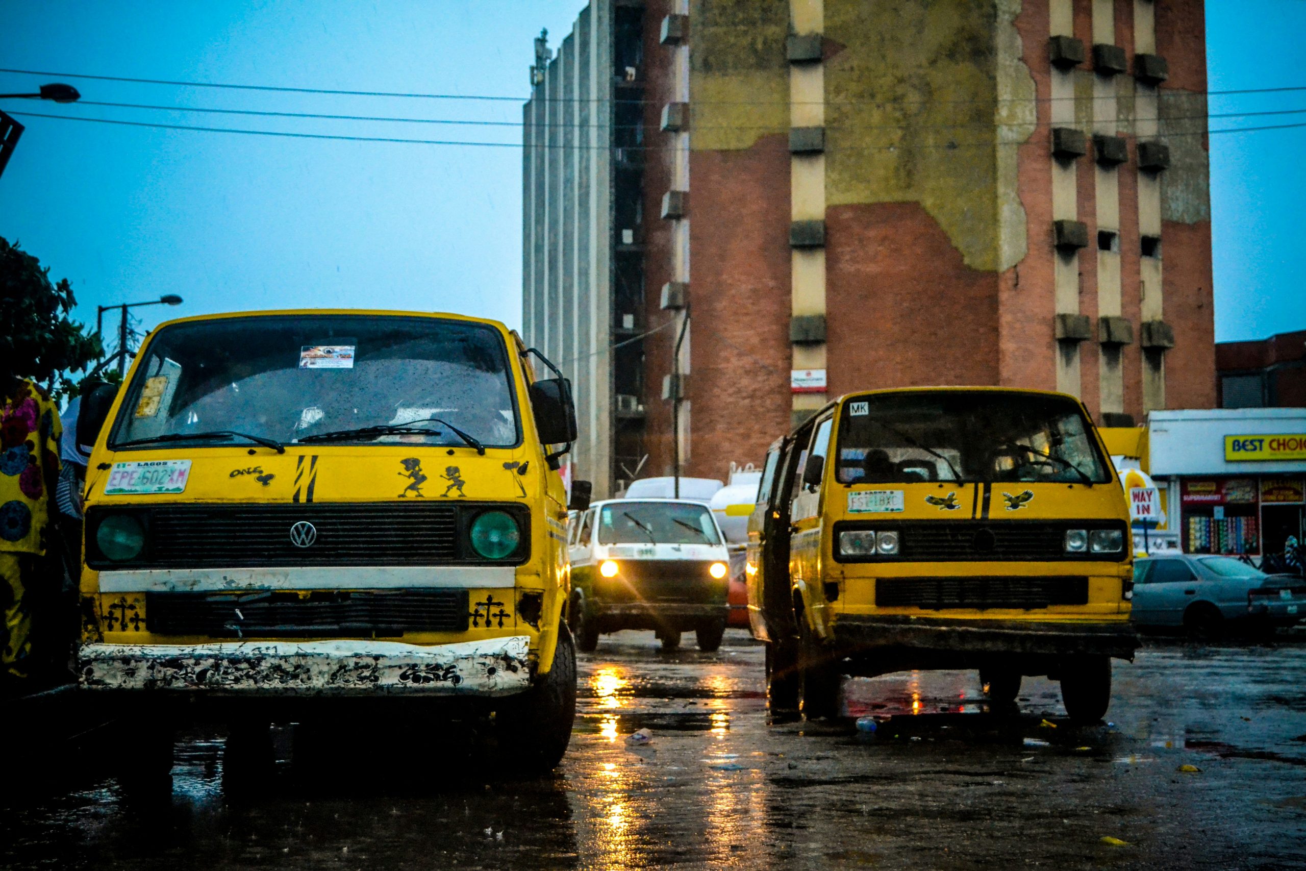 A yellow danfo minibus on a Lagos street