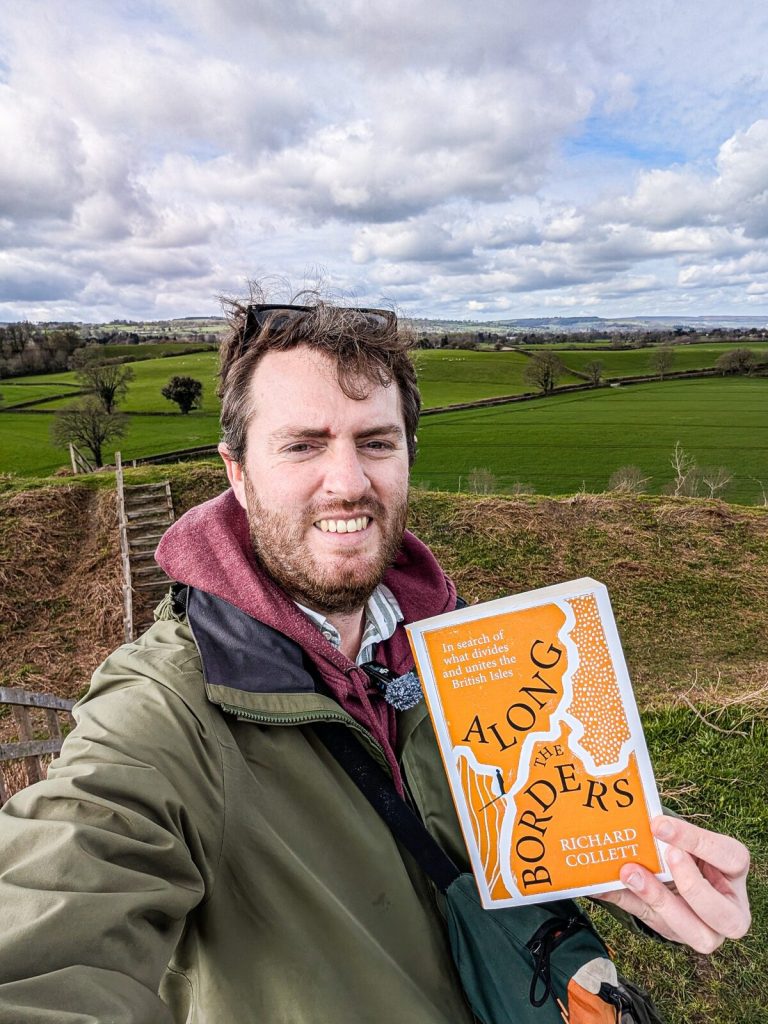 Richard Collett holding his book Along the Borders