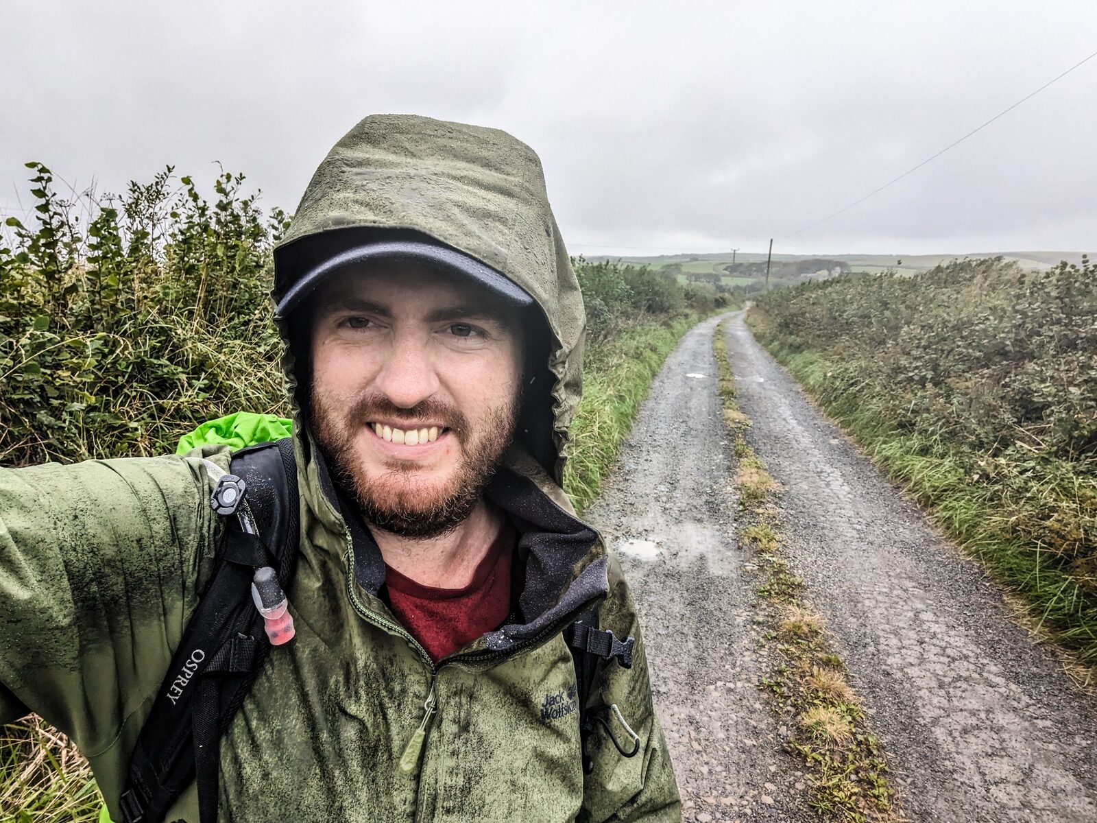 Richard Collett hiking through wet weather in Cornwall
