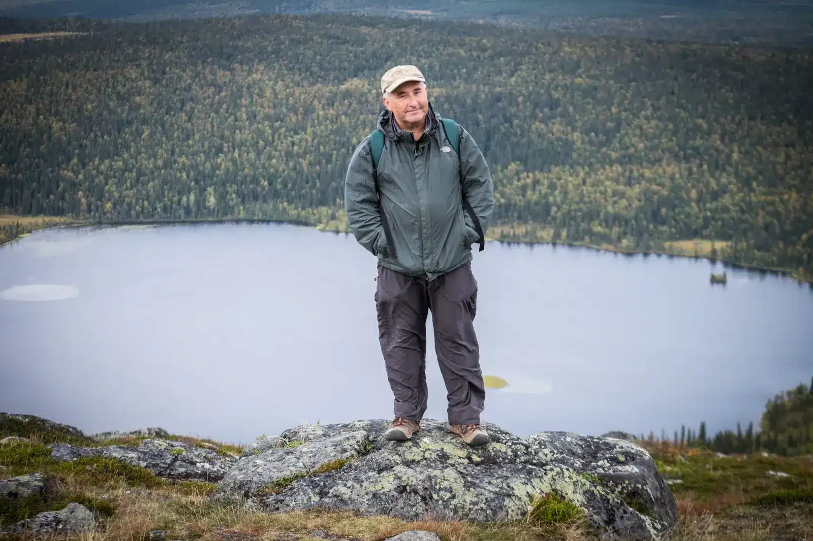 Tim Bird standing above a lake in Finnish Lapland