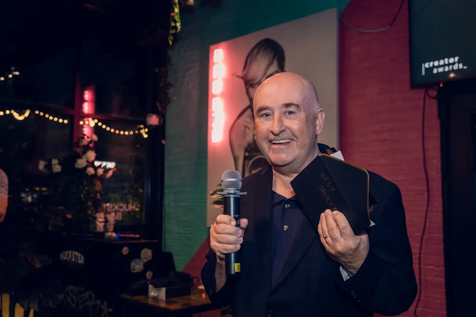 Tim Bird holding an award at the Traverse Creator Awards