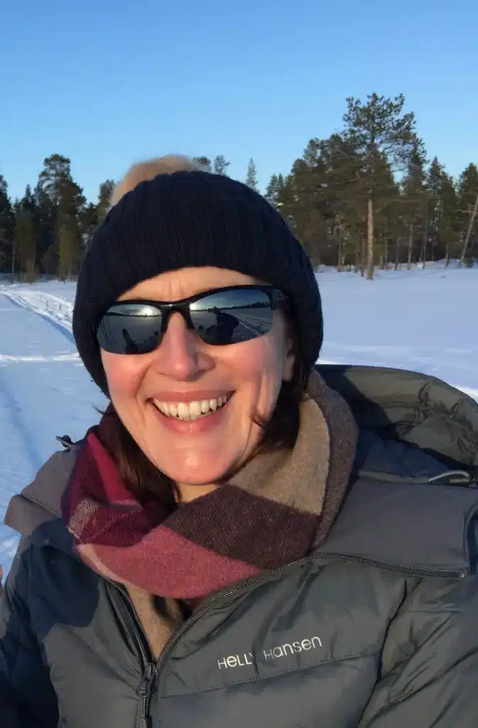 Jo Robertson in winter clothing outdoors in a snowy landscape