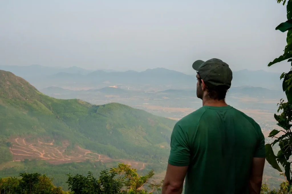 Joshua Zukas looking out across hills and countryside
